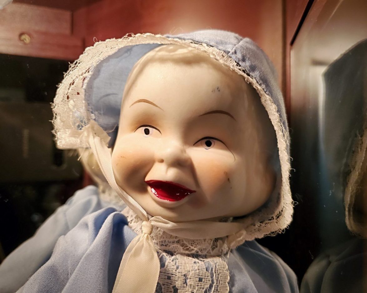 old doll with 3 faces