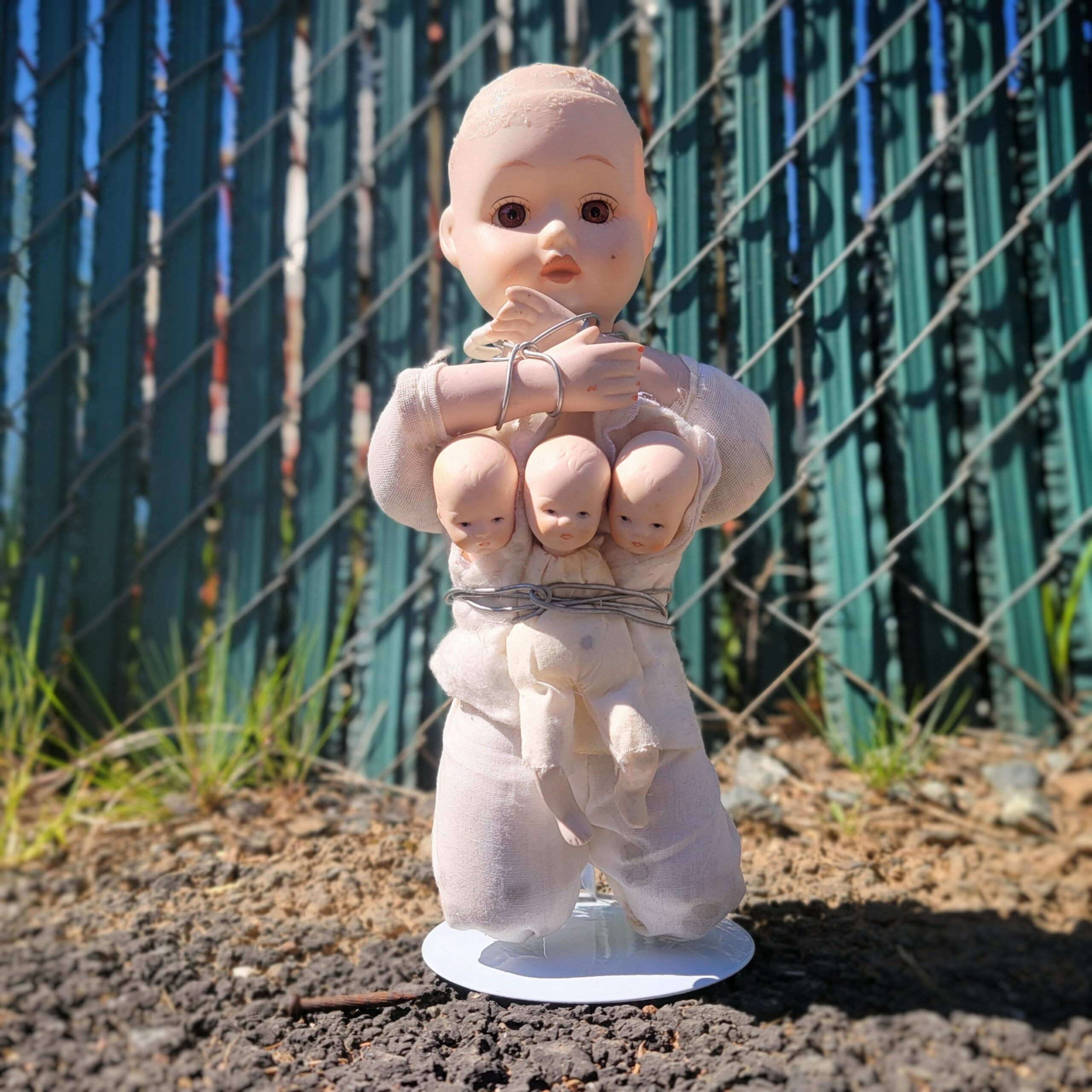 Slide 1 for Vintage Porcelain Bound Doll with Three Headed Baby